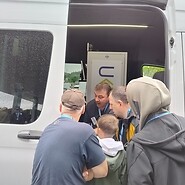 people at the measuring car