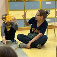 Instructors show a polish sign language to a child