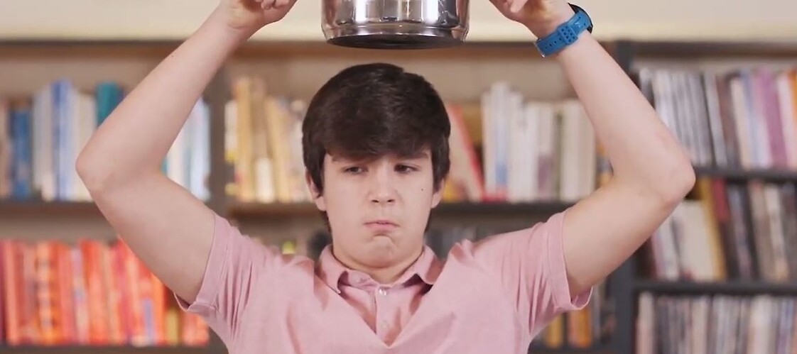 boy with hot water overhead